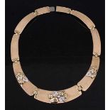 An 18 carat gold and diamond point inset sectional necklace, of graduated form, the three central