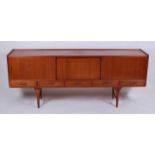 A 1960s teak long sideboard, having integral raised edge over central fall-front compartment,