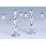 A pair of Duchin weighted sterling silver candelabra, having knopped stems and raised on circular