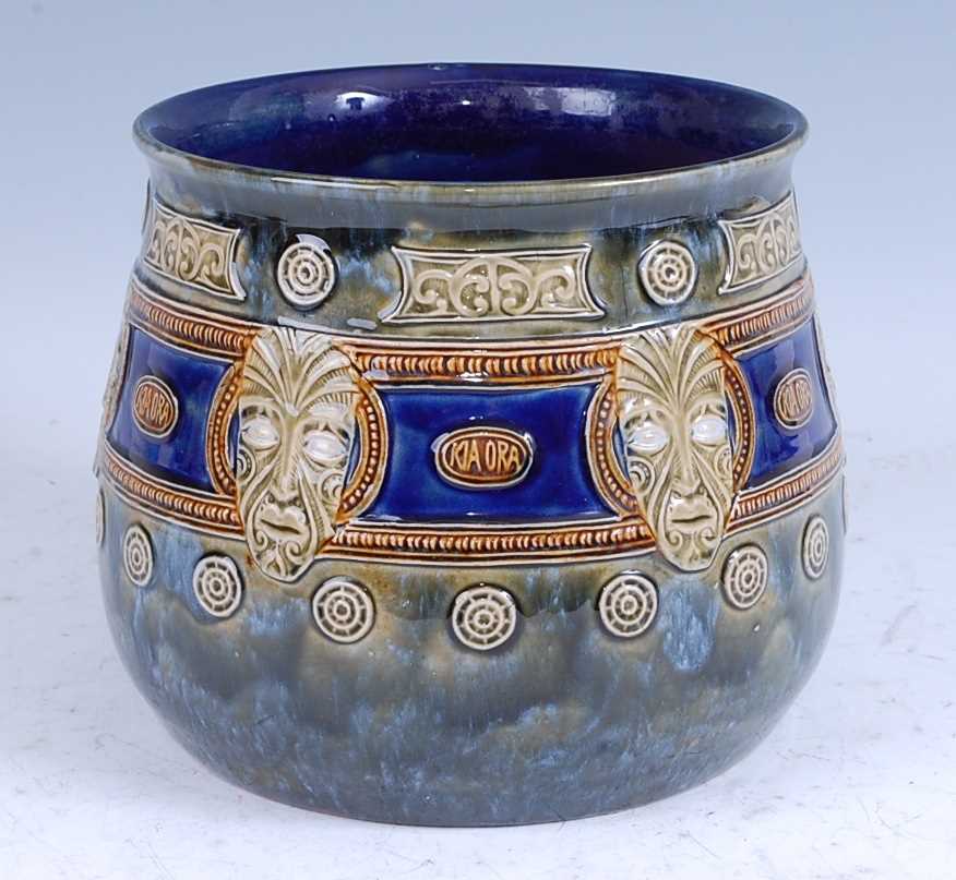 A circa 1907 Doulton Lambeth stoneware Maori-ware jardiniere, decorated with masks and inscribd '