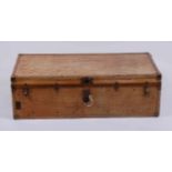 An early 20th century tan canvas, leather and metal bound fitted travelling trunk, the close