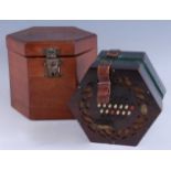 A Victorian fret carved rosewood concertina having twenty four buttons to one side with twenty two