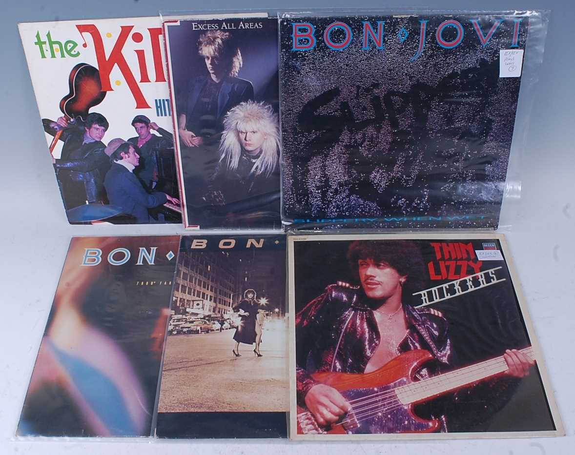 A collection of ten 12" singles and LP's to include Thin Lizzy - Thunder And Lightening/Still In