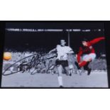 Sir Geoff Hurst, a 10 x 15cm photograph of Hurst scoring in the 1966 World Cup Final, signed in