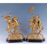 A pair of late 19th century gilt spelter figures of Crusaders on horseback, each on naturalistic