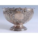 A late Victorian Scottish silver pedestal monteith, of circular form with a scalloped and pinched