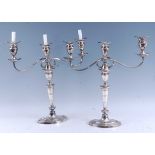 A pair of circa 1900 silver plated three-light candelabra, in the Adam style, each having detachable