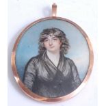 A large Georgian double-sided portrait mourning locket, one side being a miniature watercolour on