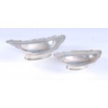 A late Victorian shallow silver dish, of elongated oval form, having shaped reeded and pierced edge,
