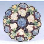 A circa 1890 Edward Bingham of Castle Hedingham pottery dish, decorated with applied masks and