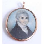 An early 19th century double-sided portrait mourning locket, one side being a portrait miniature