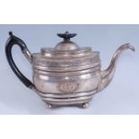 A late Georgian silver teapot, of ribbed oval bombe form with bright cut engraved decoration, 18.