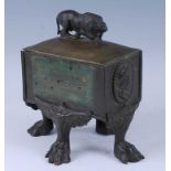 A 19th century bronze and brass table casket, the lid surmounted with a rampant lion, the casket