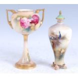 A 1911 Royal Worcester porcelain twin handled pedestal urn, decorated with roses, shape No 2736,