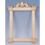 A Victorian ivory frame for portrait miniatures being ogee moulded with leaf carved applied corner