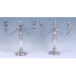 A pair of silver plated three-light candelabra in the Adam style by the Goldsmiths & Silversmiths