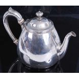 A Victorian silver bachelors teapot, of plain lower bellied form with C scroll handle having ivory