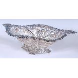 A Victorian silver openwork sweetmeat dish, of oval form with pierced and repousee scrolling