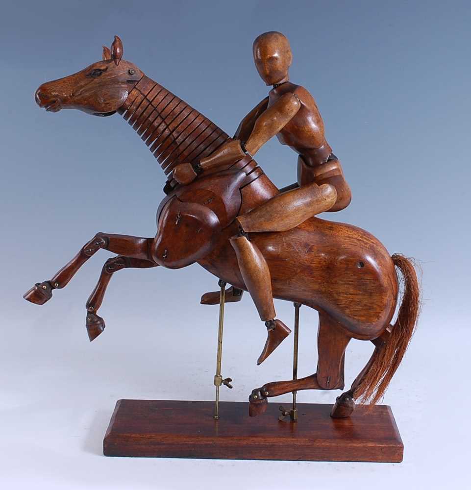 A late 19th / early 20th century French articulated walnut artist's maquette / lay figure of a rider