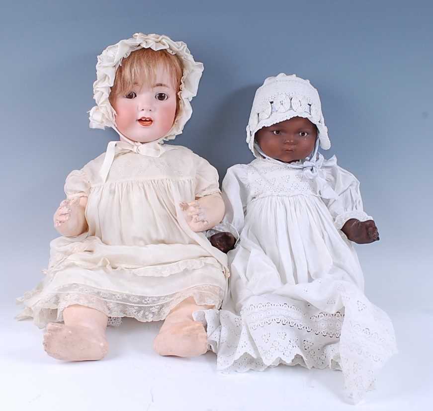 An early 20th century Ernst Heubach bisque headed doll, having sleeping brown glass eyes, open mouth