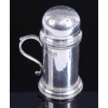 An Edwardian Britannia silver pepper pot, of cylinder form with removable pierced top and S scroll
