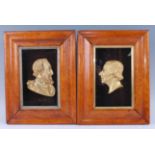 A pair of cast gilt metal plaques of Henry IV of France and Robert Owen, each in glazed birdseye