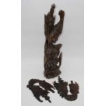 An eastern carved hardwood figure group of a couple, height 55cm, together with a similar pair of