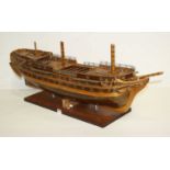 A hand built wooden model of a 17th century style ship, length 95cm