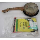 A 20th century John Gray & Sons banjolele, together with a collection of sheet music