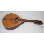 An Italian marquetry inlaid eight string mandolin, length 60cm