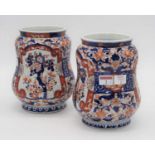 A pair of 20th century Japanese Imari vases, each of albarello form, height 21cm