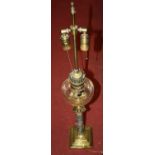 A converted oil lamp, in the form of a Corinthian column upon a stepped square plinth, height 92cm