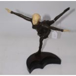 An Art Deco style bronze and resin figure of a young girl skating, signed Preifs, mounted upon a