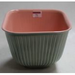 A Clarice Cliff green & pink glazed square jardiniere, designed by RY Goodden, green printed Clarice