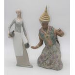 A Nao porcelain figure of a woman, height 39.5cm, together with a Lladro porcelain figure of a