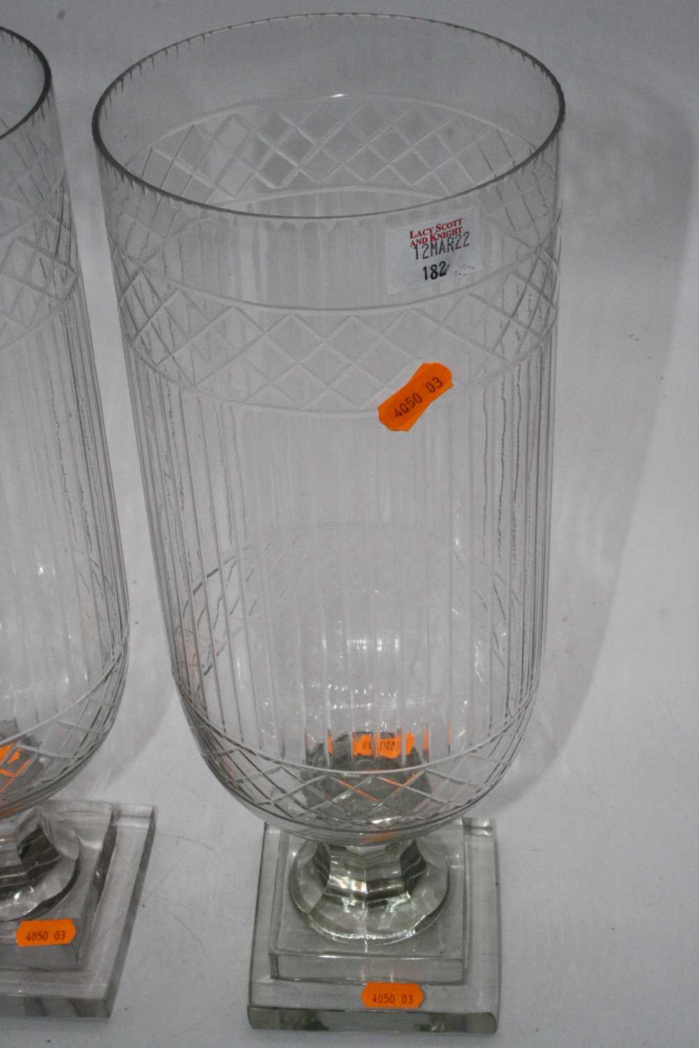 A pair of cut glass hurricane lamps, each upon a faceted stem and square stepped plinth, height - Image 4 of 6