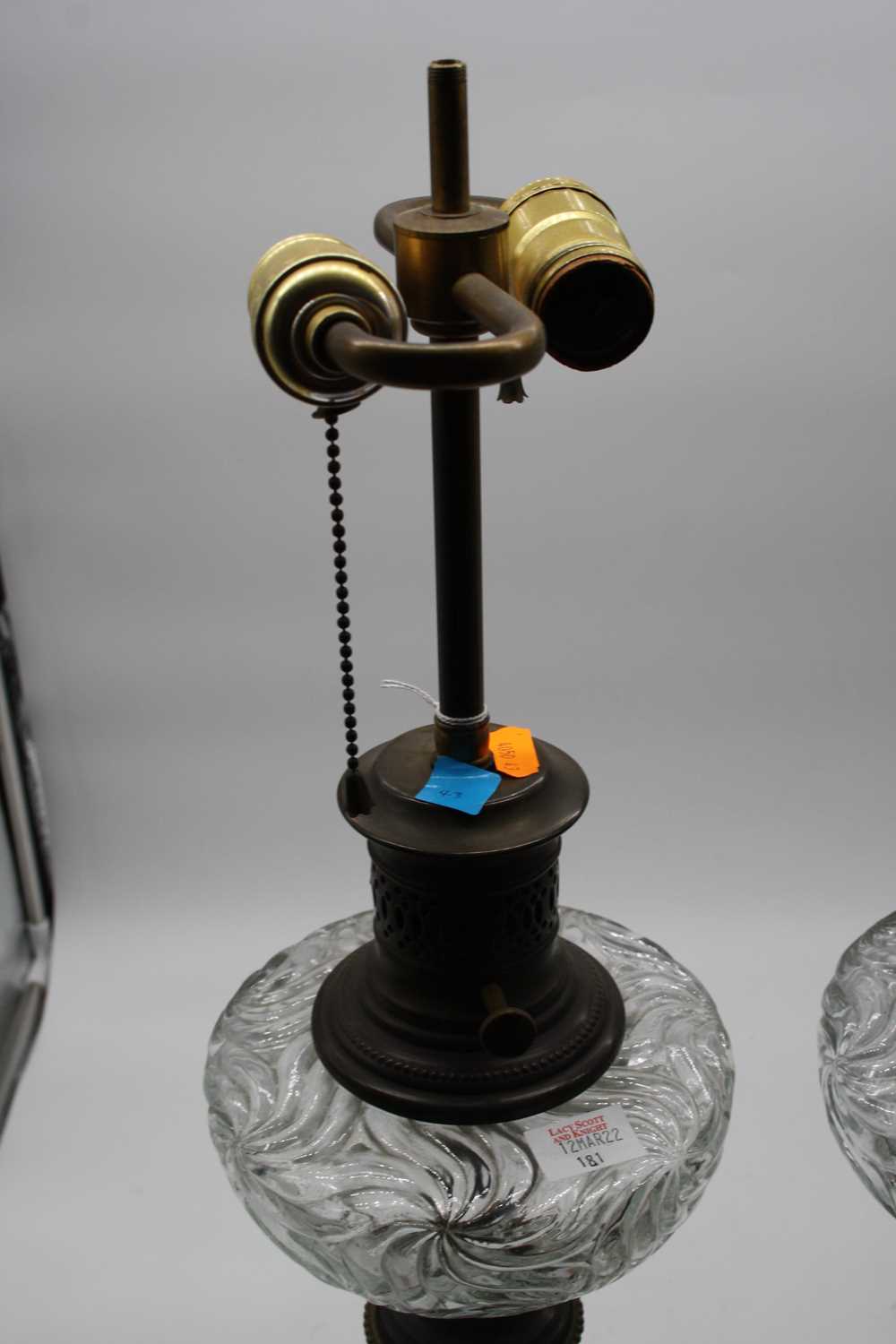 A pair of converted pressed glass oil lamps, each mounted upon a polished hardstone plinth, height - Image 2 of 7