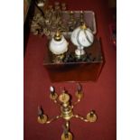 A large collection of various lighting and ornaments to include a pair of brass table candelabra and