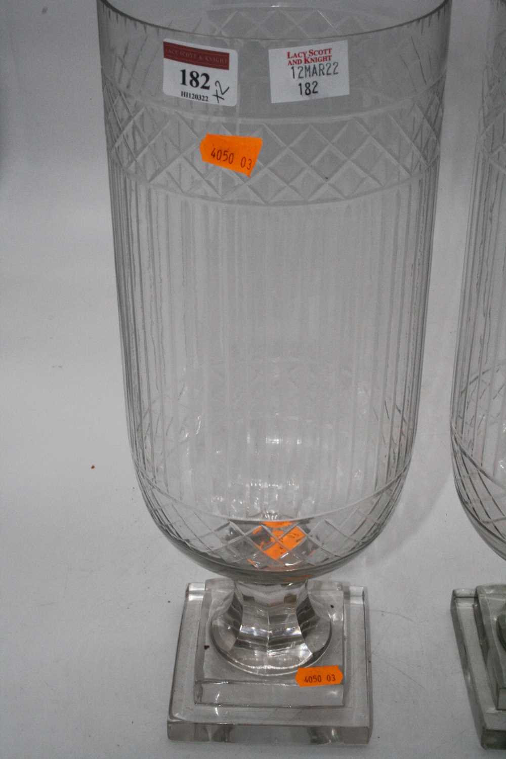 A pair of cut glass hurricane lamps, each upon a faceted stem and square stepped plinth, height - Image 3 of 6