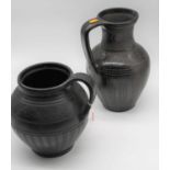 Two Hungarian black burnished pottery jugs, height 28cm