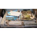 A case containing a collection of various vintage postcards, mainly topographical