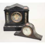 A Victorian black slate 8-day mantel clock, of architectural form, the chapter ring showing Roman