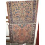 Two similar Persian red ground Shiraz rugs (each worn)