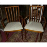 A pair of 1960s McIntosh teak slat back elbow chairs, width 64cm