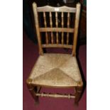 A near set of six early 20th century oak and rush seat Lancashire chairs