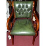 A reproduction mahogany green buttoned and studded leather single elbow chair, width 51.5cm