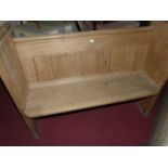 A pine two seater church pew, width 123cm