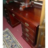 A contemporary hardwood twin pedestal writing desk, having typical arrangement of nine drawers,