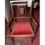 An Edwardian mahogany and inlaid salon elbow chair, having a fixed upholstered pad seat, width 53.