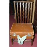 An early 20th century beech splatback cane seat nursing chair, together with a vellum travel case (